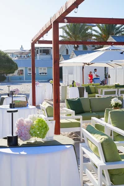 Restaurant entrance with the Sandbar sign welcoming guests to a vibrant waterfront dining destination.