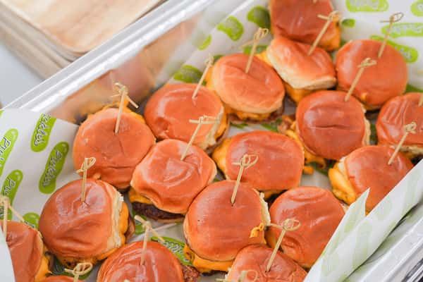 Freshly made mini sliders on soft buns, served as bite-sized favorites for catered events and group gatherings.