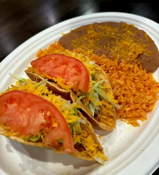 tacos and mexican food on white plate
