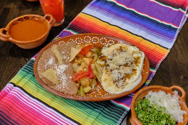 Huevos Ranchero on top of a colorful mantle