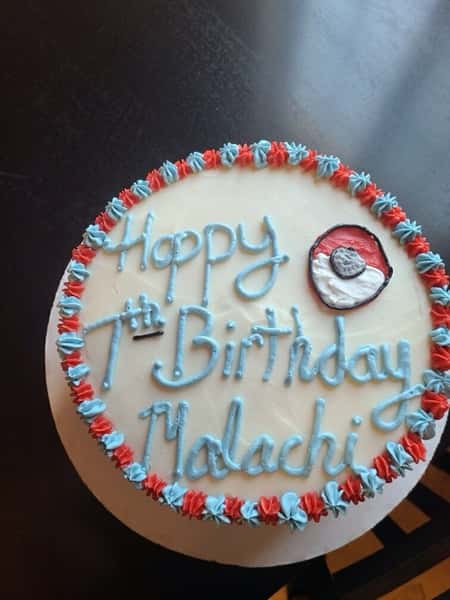 cake that says "happy 7th birthday Malachi"
