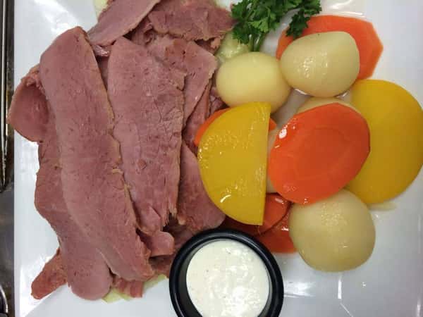 Corned beef with boiled potatoes and steamed vegetables