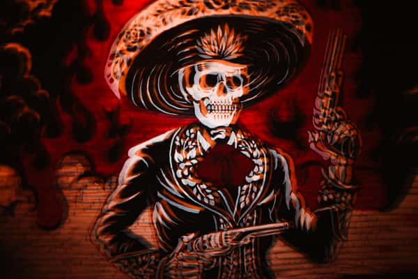 Calaveras de Azúcar (Sugar Skull cowboy with guns) wall mural