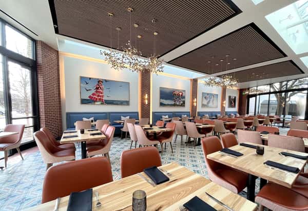Signature handcrafted cocktails at Hugo's restaurant bar featuring colorful mixed drinks and a refreshing upscale dining experience.