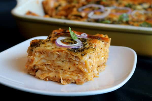 Southern-style potato casserole topped with melted cheese and served as a comforting side dish at Hugo's restaurant.
