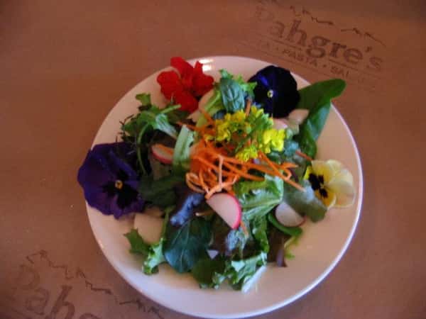 Aesthetically crafted salad with flowers