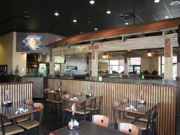 Interior dining area with kitchen in the background