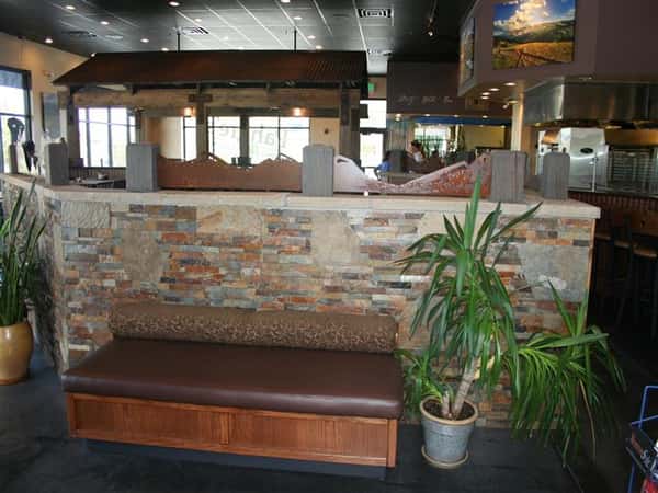 Waiting area with mini tree plant next to a bench