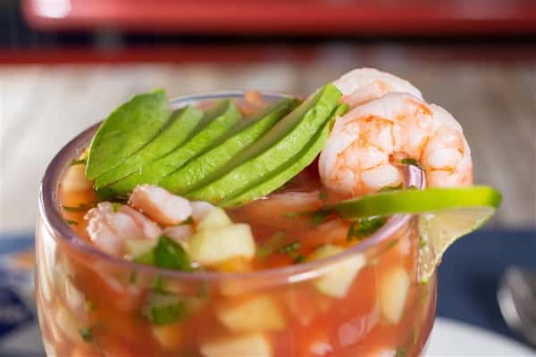 A closeup view of a Mexican style shrimp cocktail.-min