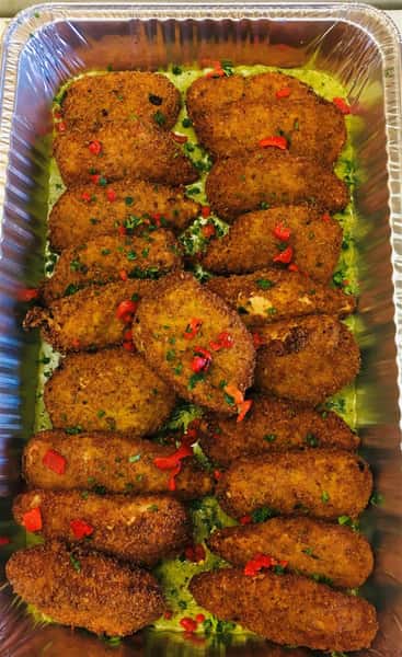 Herb Crusted Roasted Chicken Coated in olive oil and Dijon mustard then dredged in seasoned bread crumbs