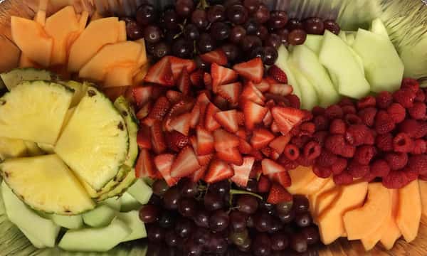 catering display of an assortment of sliced fruit