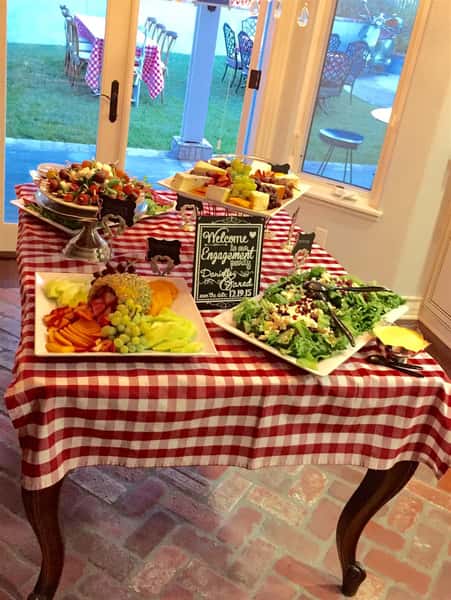 catering display table of various dishes for an engagement party