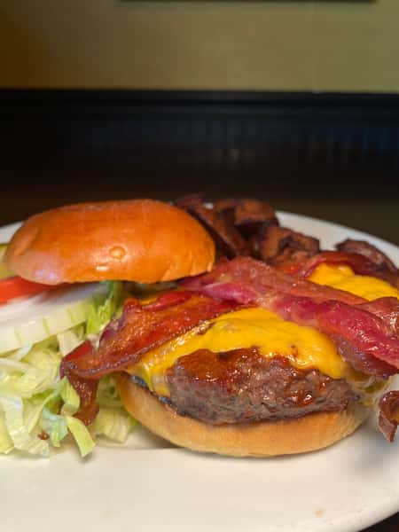 BBQ Steak Burger-Flame grilled sirloin steak burger with our Famous BBQ sauce, crispy hickory smoked bacon and melted American cheese.