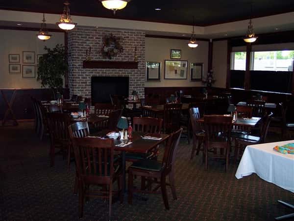 Inside of dining area showing tables of 4 seats with no guests