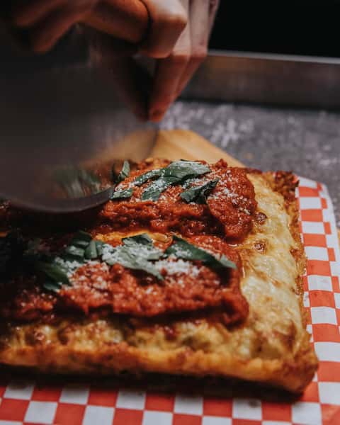 cutting pizza