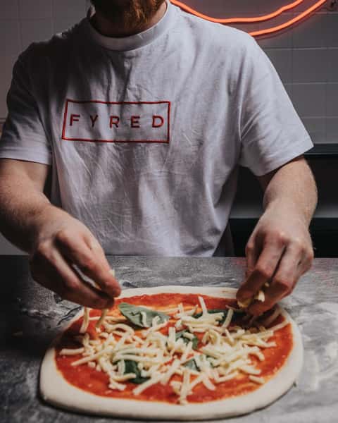 shredded cheese on pizza