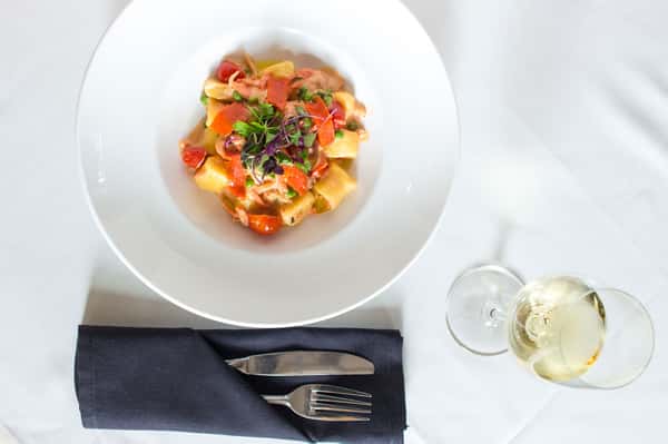 Gnocchi - Fresh potato dumplings sauteed in vodka sauce with lox and peas