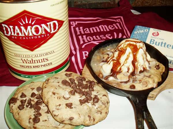 chocolate chip cookies next to a skillet with a cookie topped with ice cream