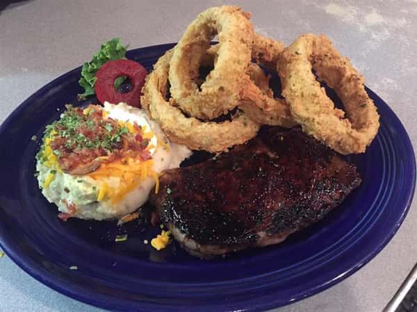 steak with mashed potatoes and onion rings
