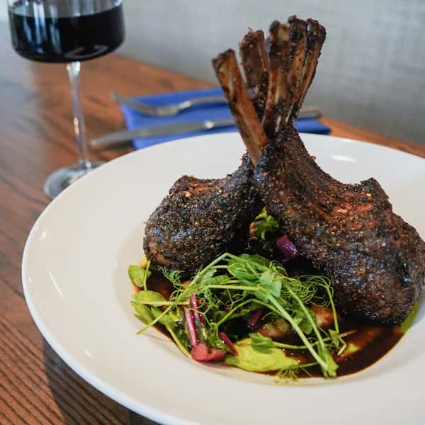 Rack of lamb and wine glass at Hamilton's Kitchen