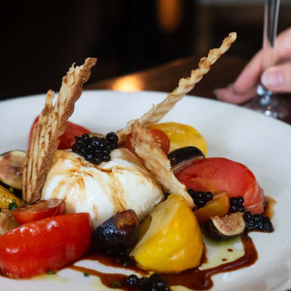 Fresh burrata, fig, and tomato salad from Hamilton's Kitchen