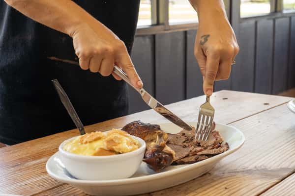 Chef slicing brisket