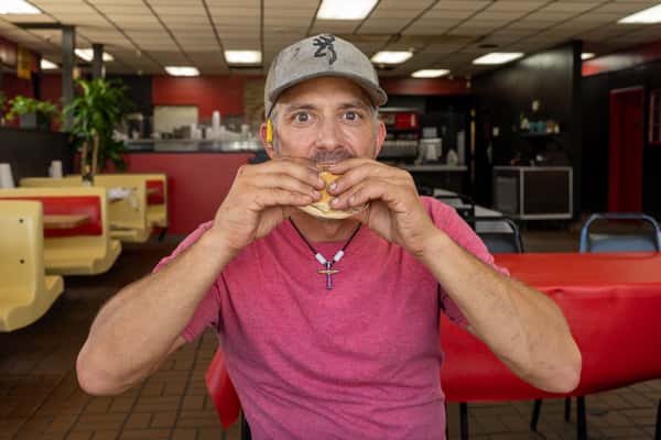 Guest enjoying a BBQ sandwich
