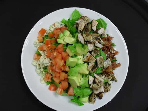 chopped romaine, blue cheese crumbles, tomato, diced avocado, diced chicken and bacon bits