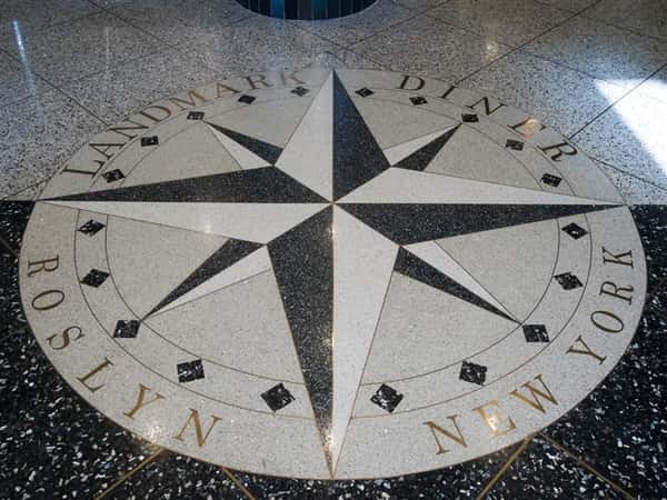 compass design on the floor with Landmark Diner written