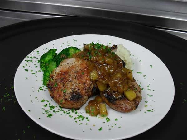 baked chicken with a side of steamed spinach and vegetable