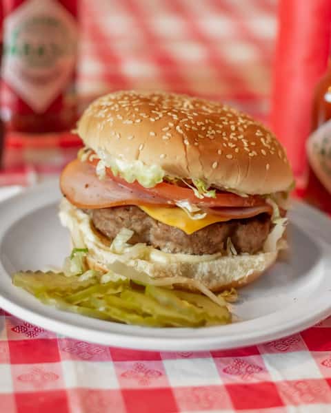Looking for a burger with a twist? Try our Canadian Burger! Juicy patty, cheese, and grilled Canadian bacon make this a standout meal. Order yours today! 🍔🥓 

pastimerestaurant.com/order

#CanadianFlavors #BurgerLovers #BatonRougeEats #OrderNow