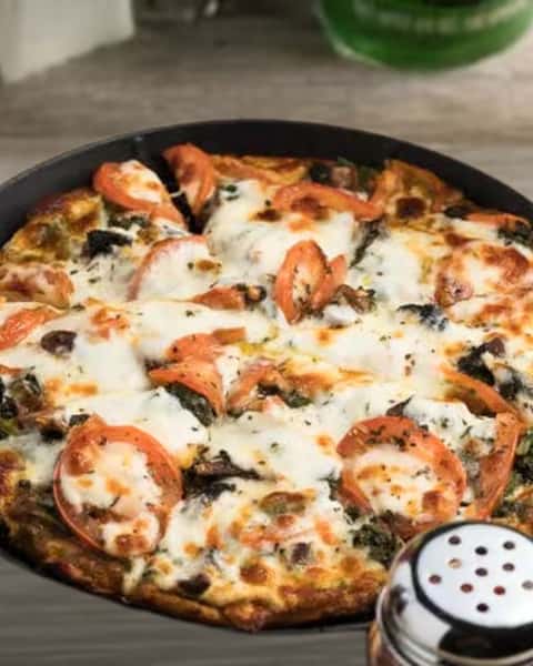 Pesto Pizza—stone deck baked and always a crowd favorite. 

#StoneDeckPizza #PastimeRestaurant