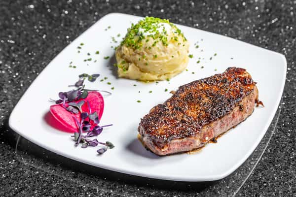 Grilled New York strip steak with creamy mashed potatoes at Gorat's Steak House in Omaha