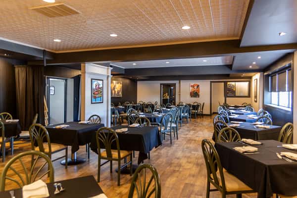 Classic dining room with neatly set tables at Gorat's Steak House in Omaha, Nebraska