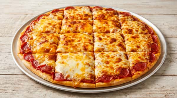 Square-cut pepperoni pizza, topped with melted and bubbly cheese, on a white tray.