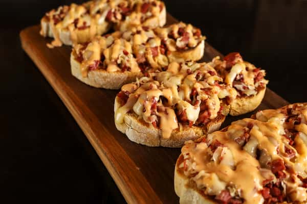 Seasonal Bruschetta: Corned beef, Sauerkraut, Swiss cheese, and 1000 island