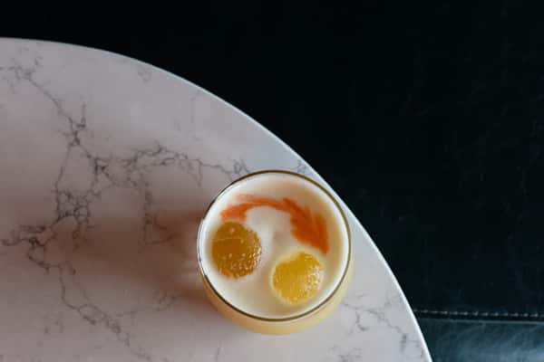top down view of a drink with circular ice balls
