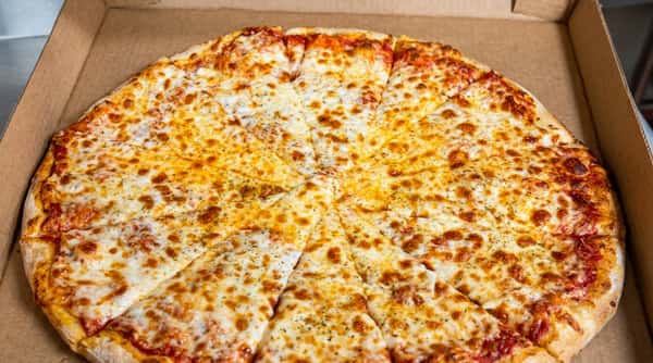 Whole cheese pizza with melted, browned mozzarella cheese in a cardboard delivery box.