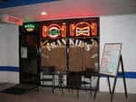 front of frankie's pizza with LED "Frankie's" sign