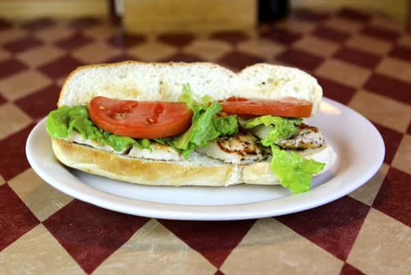 a sub with grilled chicken, lettuce and tomato