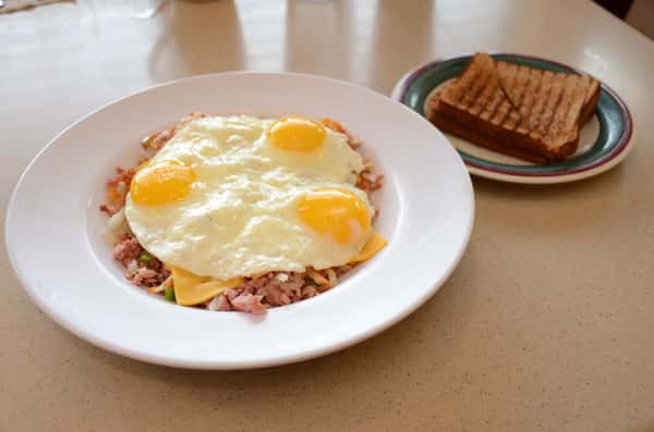fried rice with eggs and cheese on top