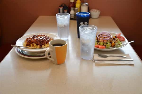 various entress with coffee and water