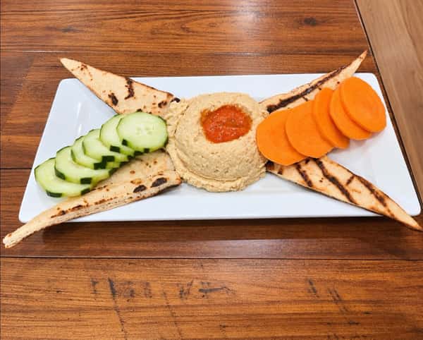Homemade Red Pepper Hummus Plate
Served w/ cucumber, carrots & grilled pita