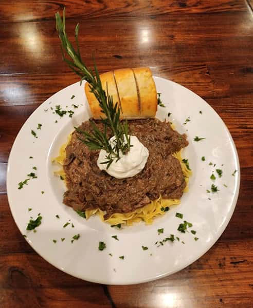 🎶 SUNDAY | Hyland Brothers | 6pm - 9pm

Beef Stroganoff
Tender braised certified angus chuck roast in a rich mushroom gravy served over egg noodles w/ toasted French bread & a dollop of sour cream
