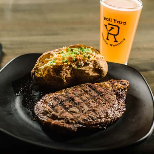Grilled meat served with a drink