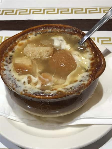 a Crock of French Onion Soup, with the inside soup contents exposed