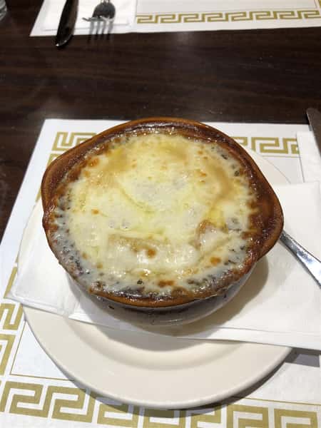 a Crock of French Onion Soup, with cheese on top