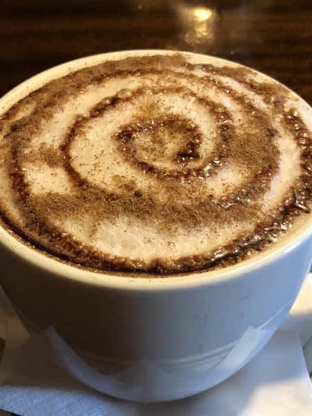 A hot chocalte with a swirl on top