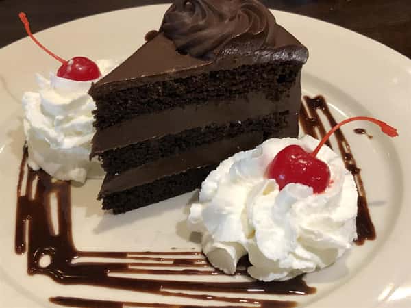 Chocolate Cake with Whipped Cream and Cherries