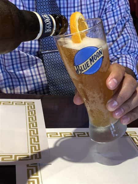 Blue Moon Beer being poured into a cup